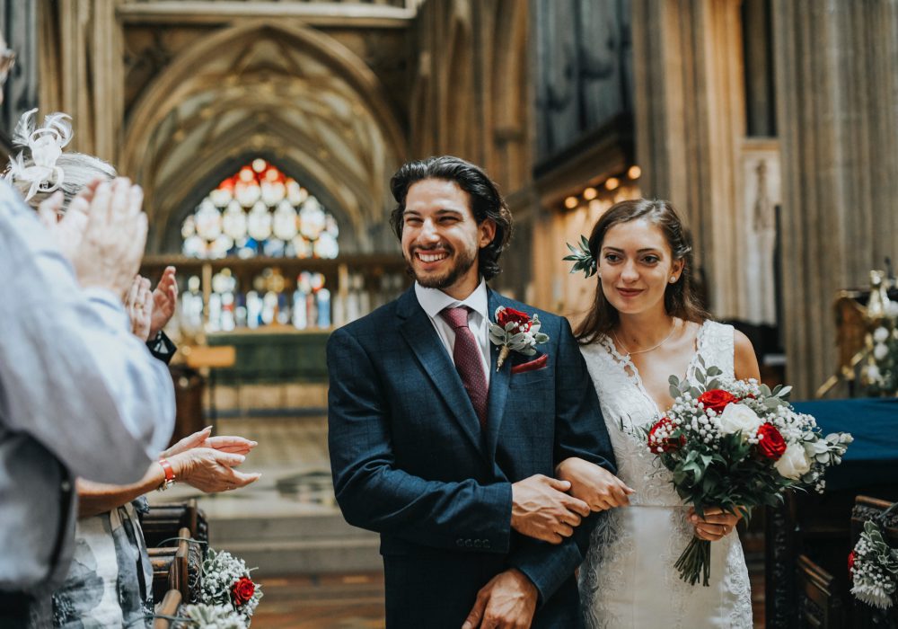 Newly wed couple walking down the aisle